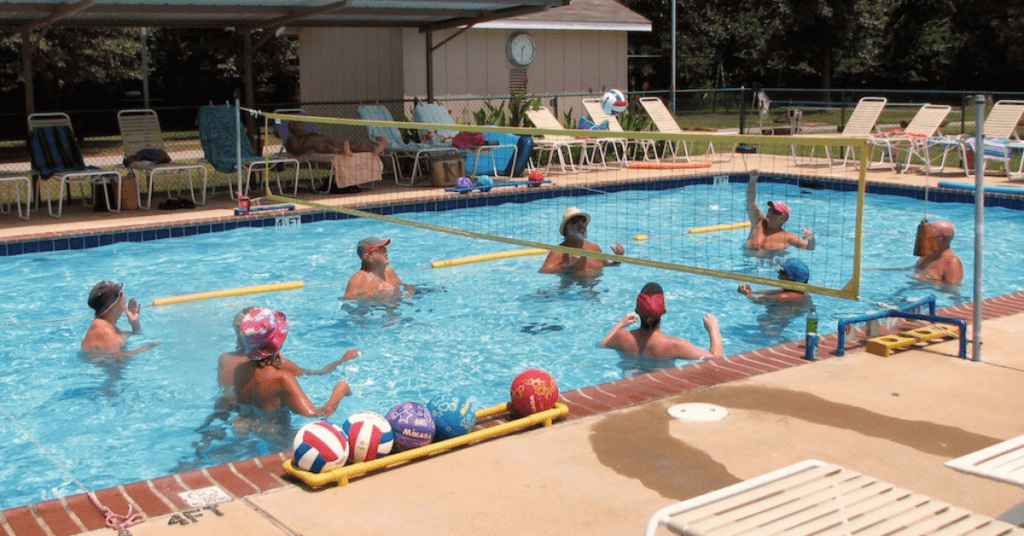 group of nudists enjoying the pool at Oaklake Nudist trails